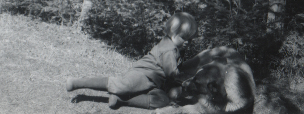Photo of three or four year-old Geoffrey with Dog
